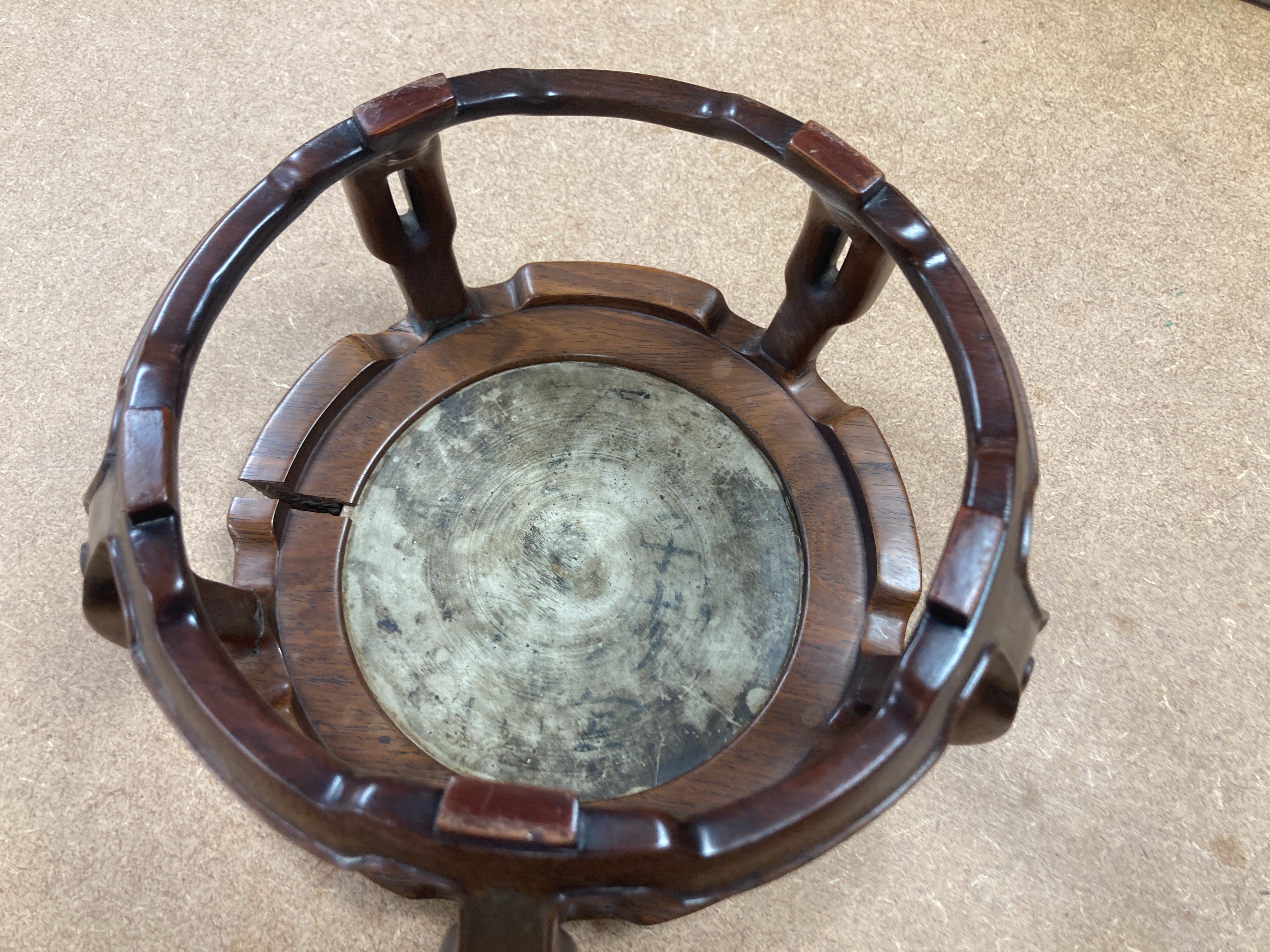 A 19th century Chinese blue and white circular tile inset hongmu stand, 22cm